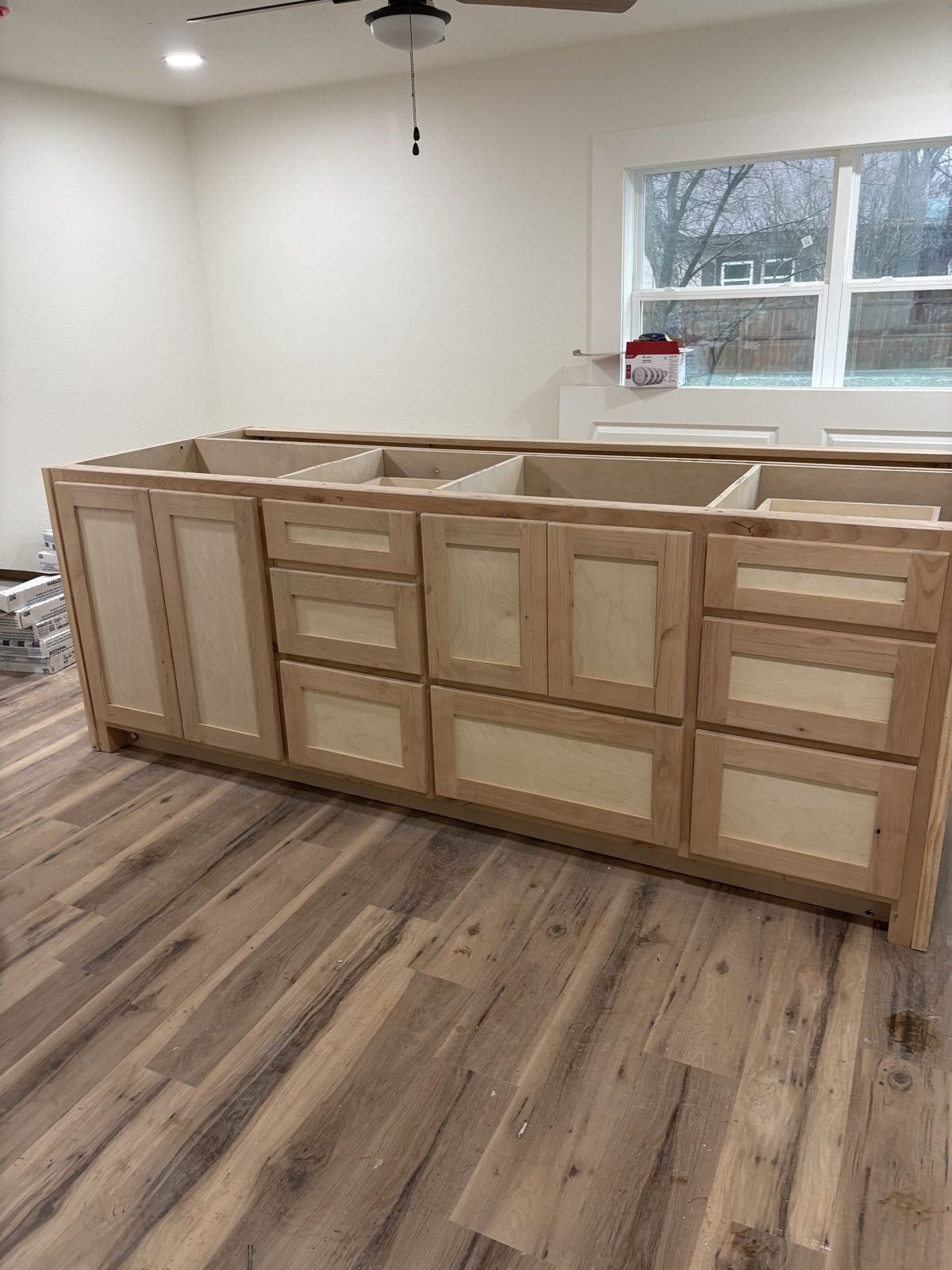 Unfinished maple kitchen island cabinetry