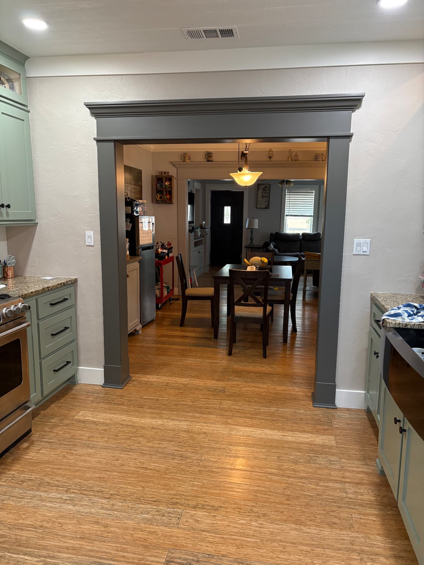 Custom cased opening leading to dining room