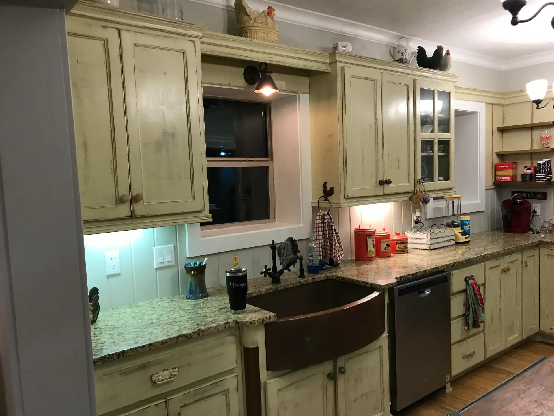 Existing farmhouse sink wall before custom cabinetry remodel