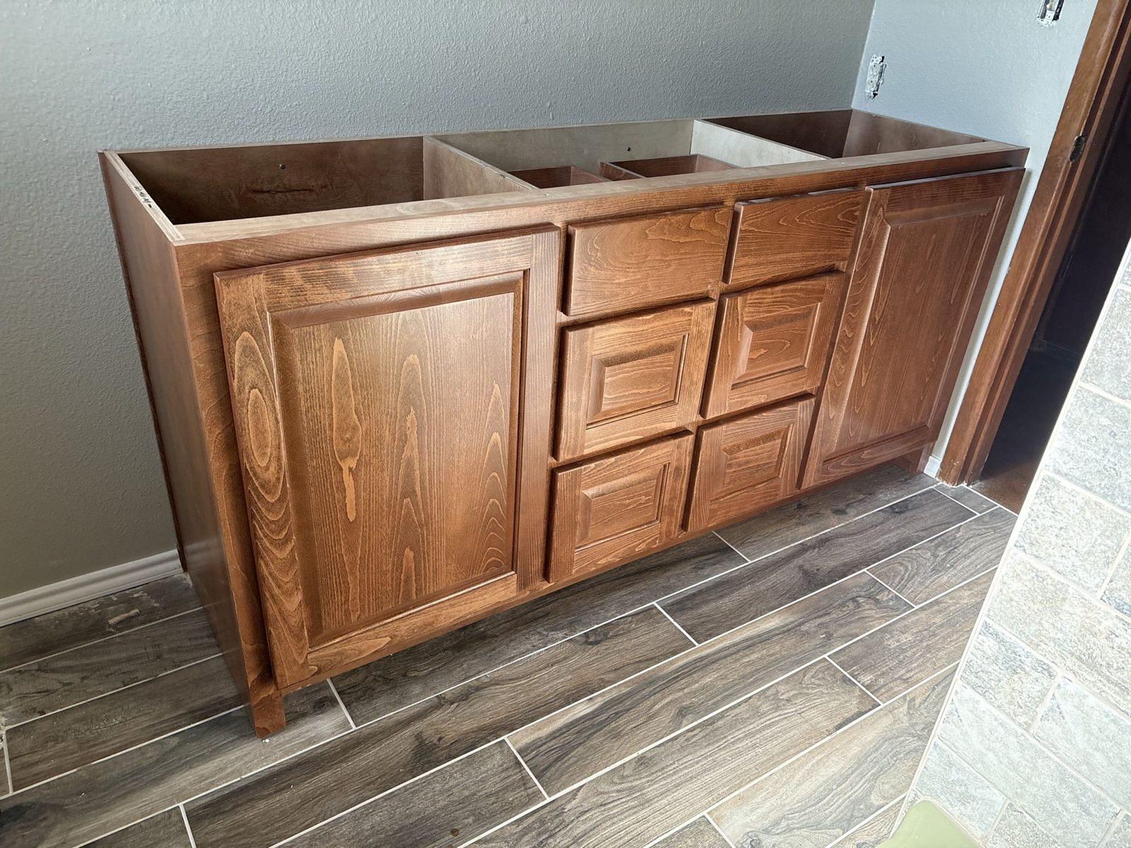 Custom stained bathroom vanity cabinet